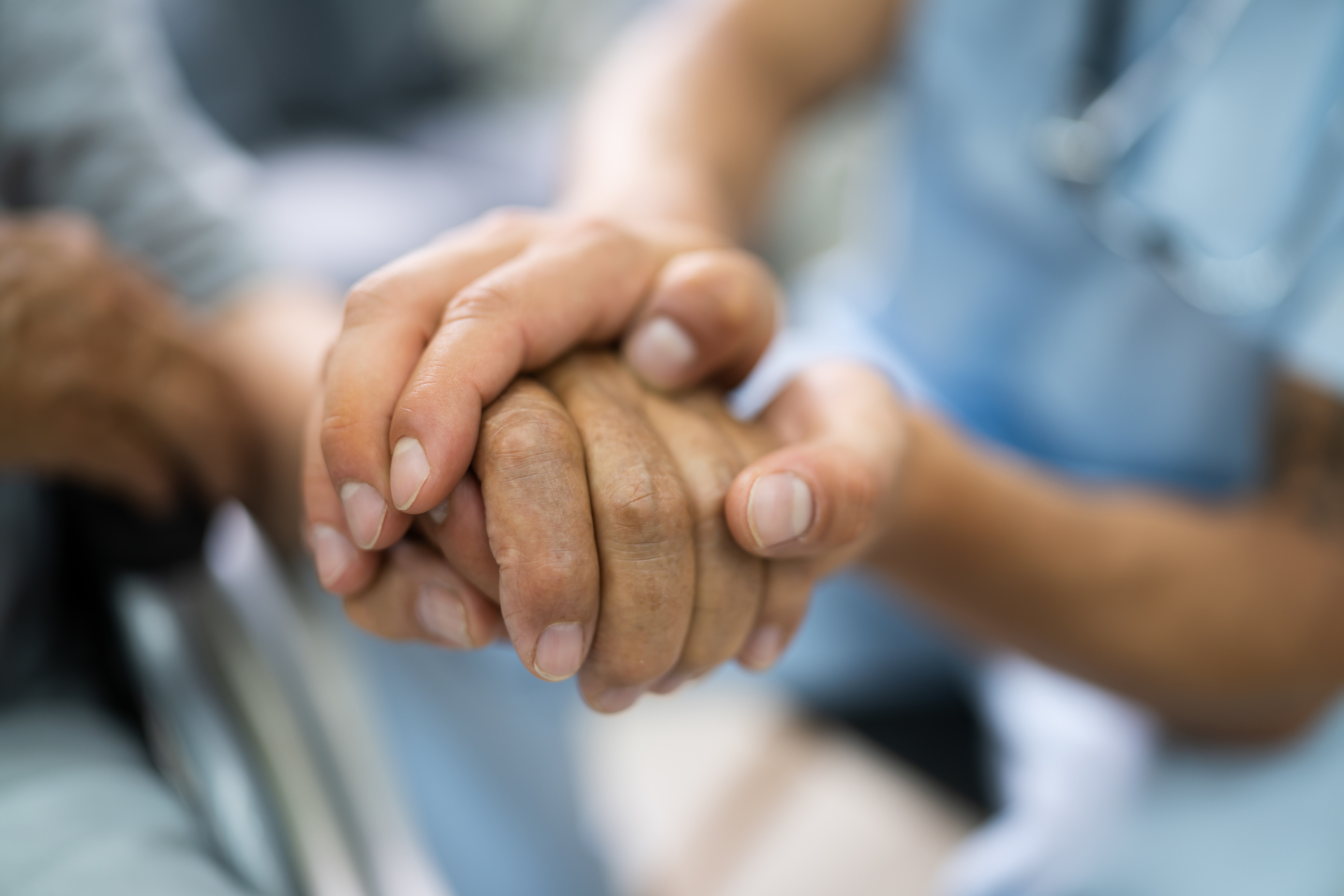 Elder Patient Helping Nurse Hand